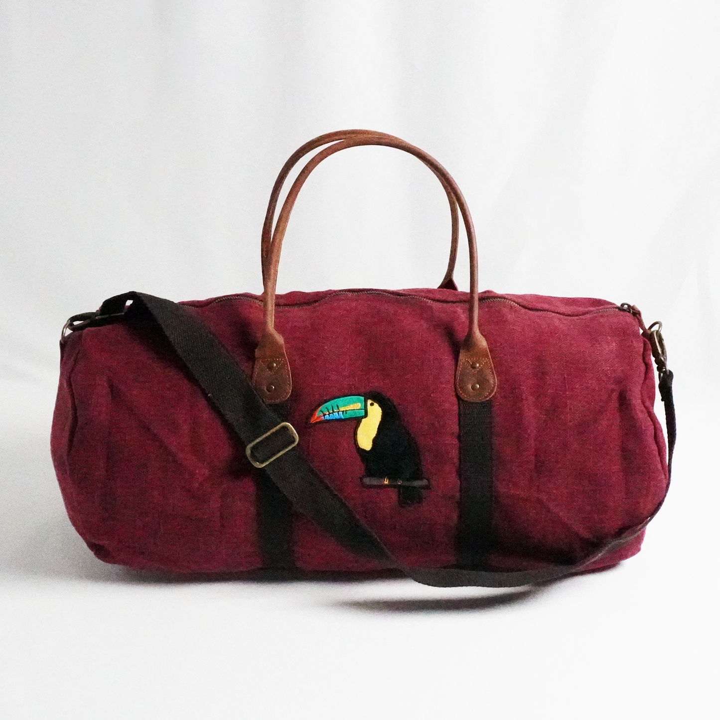 Toucan Red Jute Round Duffel – Bold Embroidered Travel Bag