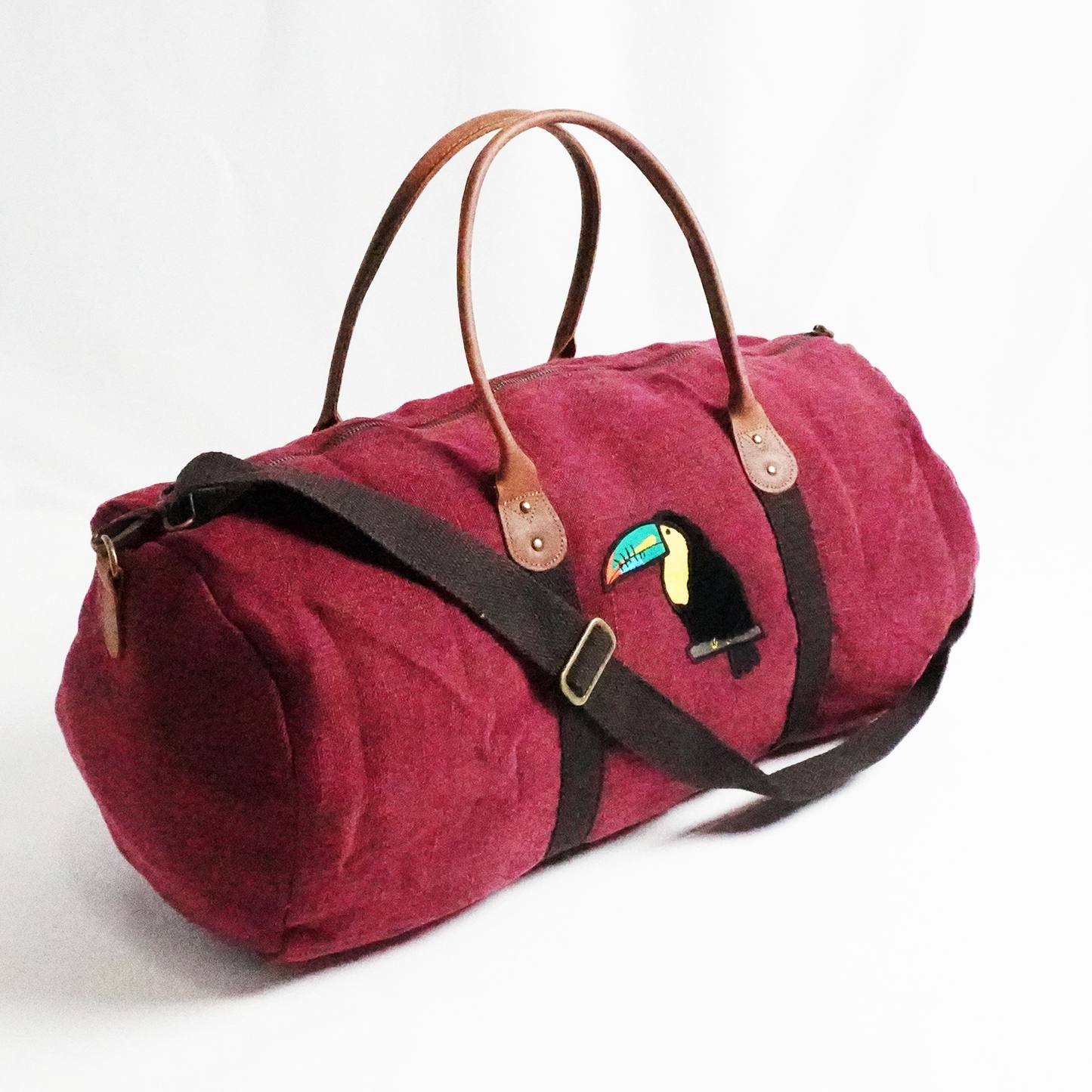 Toucan Red Jute Round Duffel – Bold Embroidered Travel Bag